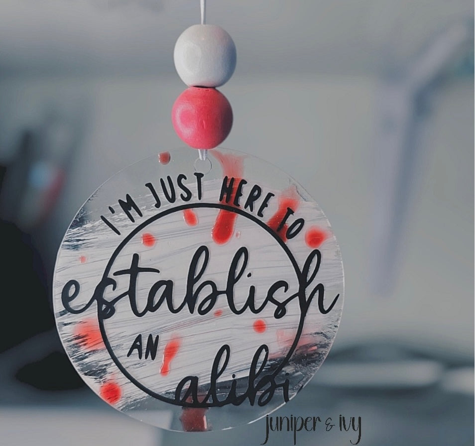 Just here for an alibi car charm