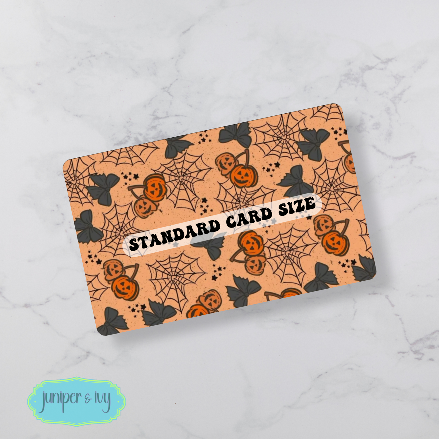 Jack-o’-lantern cherries and cobwebs credit card skin