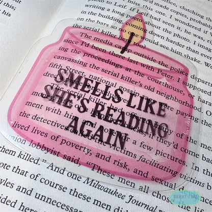 Smells like she’s reading transparent bookmark
