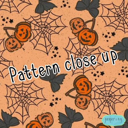 Jack-o’-lantern cherries and cobwebs credit card skin