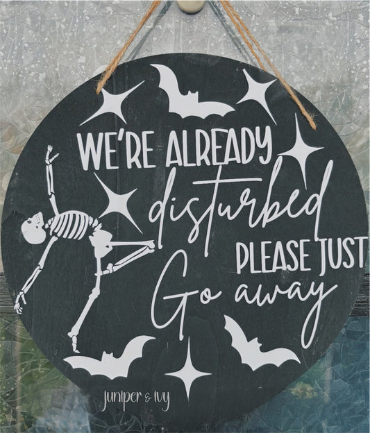 We’re already disturbed wooden door hanger