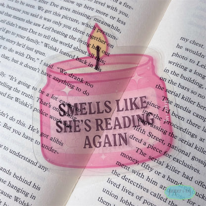 Smells like she’s reading transparent bookmark