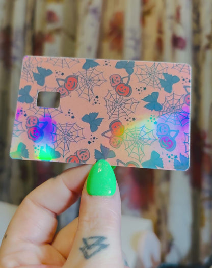 Jack-o’-lantern cherries and cobwebs credit card skin